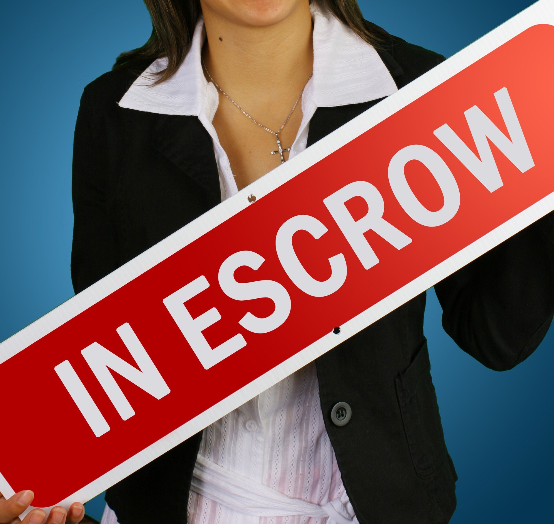 "in escrow" real estate sign